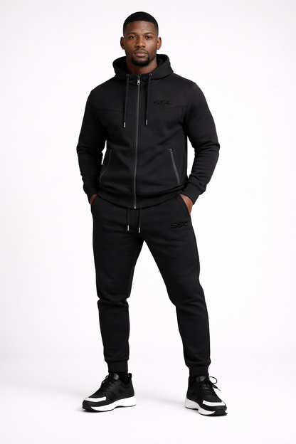 Black SSC CORE Black Tech Suit, full-length front studio view on model.