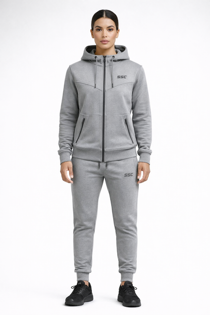 Gray SSC CORE Gray Tech Suit, model wearing full-zip hoodie and tapered joggers, front studio view.