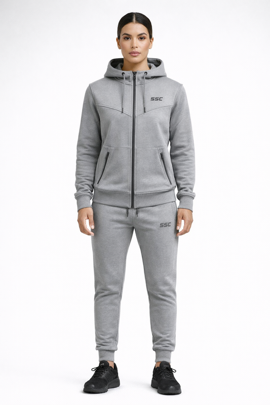 Gray SSC CORE Gray Tech Suit, model wearing full-zip hoodie and tapered joggers, front studio view.