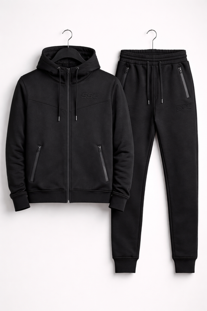 Black SSC CORE Black Tech Suit, full-zip hoodie and joggers hanging together.