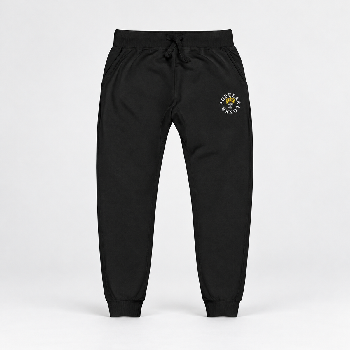 Black SSC Popular Loner Skull Embroidered Fleece Sweatpants, full front studio view with crowned skull embroidery.