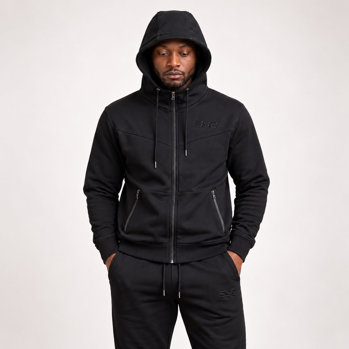 SSC CORE Black Tech Suit on a neutral studio background